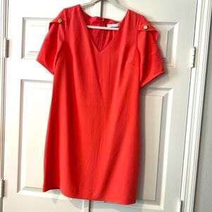 Trina Turk Lemonade dress with gold tone button accents.